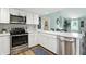 Well-lit kitchen featuring stainless steel appliances and modern countertops at 1981 N Valley Ln, Greenfield, IN 46140
