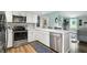 Updated kitchen with modern appliances, white cabinets and sink with backyard views at 1981 N Valley Ln, Greenfield, IN 46140