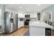 Modern kitchen with stainless steel appliances, white cabinets, and breakfast bar at 1981 N Valley Ln, Greenfield, IN 46140