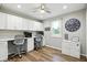 Functional home office featuring built-in desks, ample storage cabinets, and a window for natural light at 1981 N Valley Ln, Greenfield, IN 46140