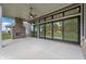 Outdoor patio with fireplace, ceiling fan, and expansive glass sliding doors to the backyard at 19832 Chatsworth Blvd, Westfield, IN 46074