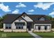 Charming single-story home with stone accents, gray siding, dark roof, and lush landscaping at 19832 Chatsworth Blvd, Westfield, IN 46074