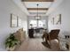 Modern office with tray ceilings, wood floors, and a large window providing ample natural light at 19832 Chatsworth Blvd, Westfield, IN 46074