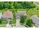Aerial view of property featuring well-maintained landscaping, a trampoline, and a long driveway at 2029 Seven Peaks Dr, Cicero, IN 46034