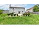 Spacious backyard features a stone patio, barbecue, and mature landscaping, perfect for outdoor enjoyment at 2029 Seven Peaks Dr, Cicero, IN 46034