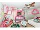 Pink bedroom decorated with dolls, stuffed animals, and stickers at 2029 Seven Peaks Dr, Cicero, IN 46034