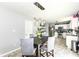 Dining room with chandelier open to kitchen, providing a cozy space for meals and gatherings at 2029 Seven Peaks Dr, Cicero, IN 46034