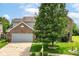 Exterior shot showcasing a two-story home with a spacious two-car garage and a well-manicured lawn at 2029 Seven Peaks Dr, Cicero, IN 46034