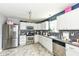 Bright kitchen features stainless steel appliances, white cabinets, and a modern aesthetic at 2029 Seven Peaks Dr, Cicero, IN 46034