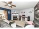 Cozy living room featuring a fireplace, ceiling fan, and comfortable seating at 2029 Seven Peaks Dr, Cicero, IN 46034