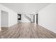 Open basement with modern flooring, staircase, barn door, and kitchenette at 20450 Chatham Hills Blvd, Westfield, IN 46074