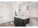 Elegant bathroom featuring a dark wood vanity with a marble countertop, and a shower and tub combo at 20450 Chatham Hills Blvd, Westfield, IN 46074