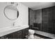 Modern bathroom featuring a dark vanity, white countertop, and glass walk-in shower at 20450 Chatham Hills Blvd, Westfield, IN 46074