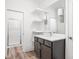 Bright bathroom boasting a dark wood vanity with a marble countertop, and a shower with glass doors at 20450 Chatham Hills Blvd, Westfield, IN 46074