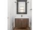 Bathroom with a modern vanity, dark wood cabinet and brushed nickel hardware at 20450 Chatham Hills Blvd, Westfield, IN 46074