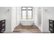 Symmetrical bathroom featuring a soaking tub, walk-in shower and double vanity at 20450 Chatham Hills Blvd, Westfield, IN 46074