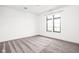 Bright bedroom showcasing a large window and neutral carpeting at 20450 Chatham Hills Blvd, Westfield, IN 46074