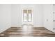 Bright bedroom featuring two windows with shades and beautiful hardwood flooring at 20450 Chatham Hills Blvd, Westfield, IN 46074