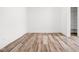 Neutral-toned bedroom with wood-look floors, and access to the closet at 20450 Chatham Hills Blvd, Westfield, IN 46074