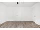 Bedroom featuring a fan, wood-look flooring and a double door closet at 20450 Chatham Hills Blvd, Westfield, IN 46074