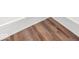 Close-up of light wood flooring with white trim, showcasing the home's modern and stylish finishes at 20450 Chatham Hills Blvd, Westfield, IN 46074