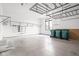 Spacious three-car garage with overhead storage, offering ample room for vehicles and organization at 20450 Chatham Hills Blvd, Westfield, IN 46074