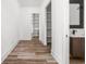 A hallway features white trim and leads to multiple rooms in the home at 20450 Chatham Hills Blvd, Westfield, IN 46074
