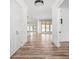 Hallway featuring hardwood flooring leading to an open concept living space with a modern design at 20450 Chatham Hills Blvd, Westfield, IN 46074