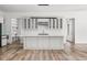Gourmet kitchen featuring white cabinets, a center island, and modern appliances at 20450 Chatham Hills Blvd, Westfield, IN 46074