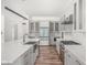 A kitchen featuring custom cabinets, stainless steel appliances, and a large sink at 20450 Chatham Hills Blvd, Westfield, IN 46074