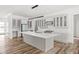 Spacious kitchen featuring a center island, custom cabinets and modern lighting fixtures at 20450 Chatham Hills Blvd, Westfield, IN 46074