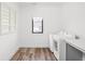 Laundry room with window and modern washer and dryer at 20450 Chatham Hills Blvd, Westfield, IN 46074