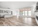Spacious living room with natural light, fireplace, hardwood flooring, and neutral tones at 20450 Chatham Hills Blvd, Westfield, IN 46074