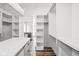 Spacious walk-in closet featuring custom shelving and hardwood flooring at 20450 Chatham Hills Blvd, Westfield, IN 46074