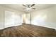 Bedroom featuring updated flooring, freshly painted neutral walls, ceiling fan and closet at 2563 Harlan St, Indianapolis, IN 46203