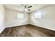 Bedroom featuring updated flooring, freshly painted neutral walls, and ceiling fan at 2563 Harlan St, Indianapolis, IN 46203