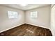 Bedroom featuring updated flooring, freshly painted neutral walls, and closet at 2563 Harlan St, Indianapolis, IN 46203