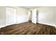 Bedroom featuring updated flooring, freshly painted neutral walls, and closet at 2563 Harlan St, Indianapolis, IN 46203