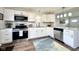 Modern kitchen with stainless steel appliances, sleek countertops, and ample cabinet space at 2563 Harlan St, Indianapolis, IN 46203