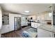 Modern kitchen with stainless steel appliances, white cabinets, and granite countertops at 2563 Harlan St, Indianapolis, IN 46203