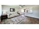 Bright living room featuring an open layout, stylish rug, and view of the kitchen at 2563 Harlan St, Indianapolis, IN 46203