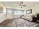 Well-lit living room with a decorative rug, comfortable seating, and hardwood floors at 2563 Harlan St, Indianapolis, IN 46203