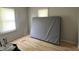 Bedroom features two windows, neutral walls, and laminate floors at 3190 S Tacoma Ave, Indianapolis, IN 46237
