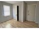 Small bedroom featuring a window, closet, and neutral walls at 3190 S Tacoma Ave, Indianapolis, IN 46237