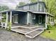 Exterior of a two-story home with a porch and some deferred maintenance at 3190 S Tacoma Ave, Indianapolis, IN 46237