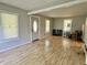 Bright living room featuring natural light, laminate floors and ample space for furniture at 3190 S Tacoma Ave, Indianapolis, IN 46237
