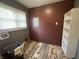 Utility room with a window and laundry hookups, offering a dedicated space for chores at 3190 S Tacoma Ave, Indianapolis, IN 46237