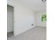 Bedroom showcasing neutral carpeting and one window, and one door at 3709 Central Ave, Indianapolis, IN 46205