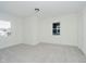 Bedroom with neutral carpeting, two windows, and white walls, a simple and elegant design at 3709 Central Ave, Indianapolis, IN 46205