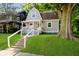 Charming front exterior of a well-maintained home with a landscaped lawn and inviting porch at 3709 Central Ave, Indianapolis, IN 46205
